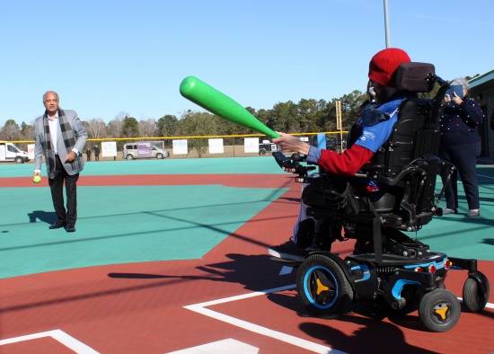 Rotary International President Shekhar Mehta pitches to Rotarian David Morrison (a former member of this club) at Wilmington's Miracle Field on Jan. 12, 2022.