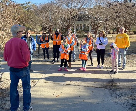 Andy McGlinn of the Plastic Ocean Project briefs Rotarians and their families about Greenfield Park cleanup