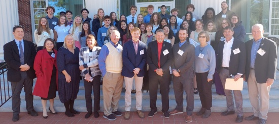 Student participants in 2024 Wilmington RYLA conference pose with Rotarian discussion leaders from five sponsoring clubs